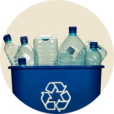plastic bottles in blue recycling bin
